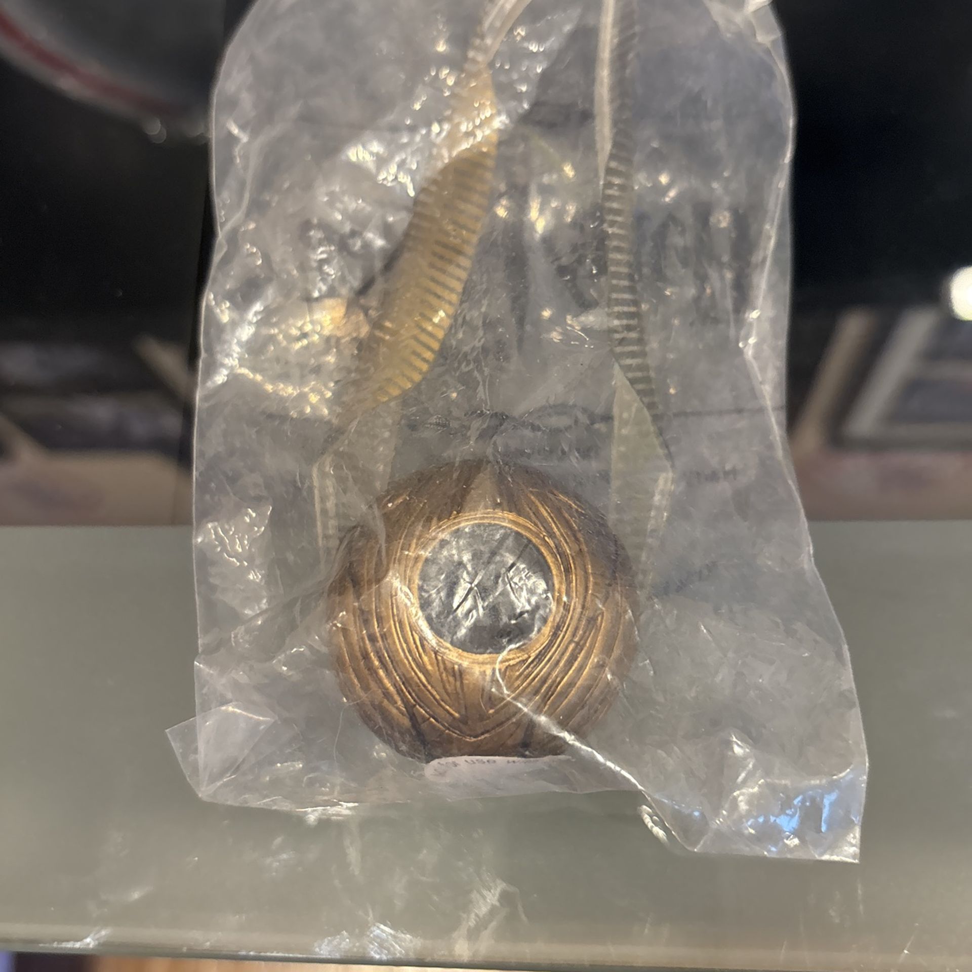 Harry Potter and the sorcerers Stone and the golden snitch from Quidditch