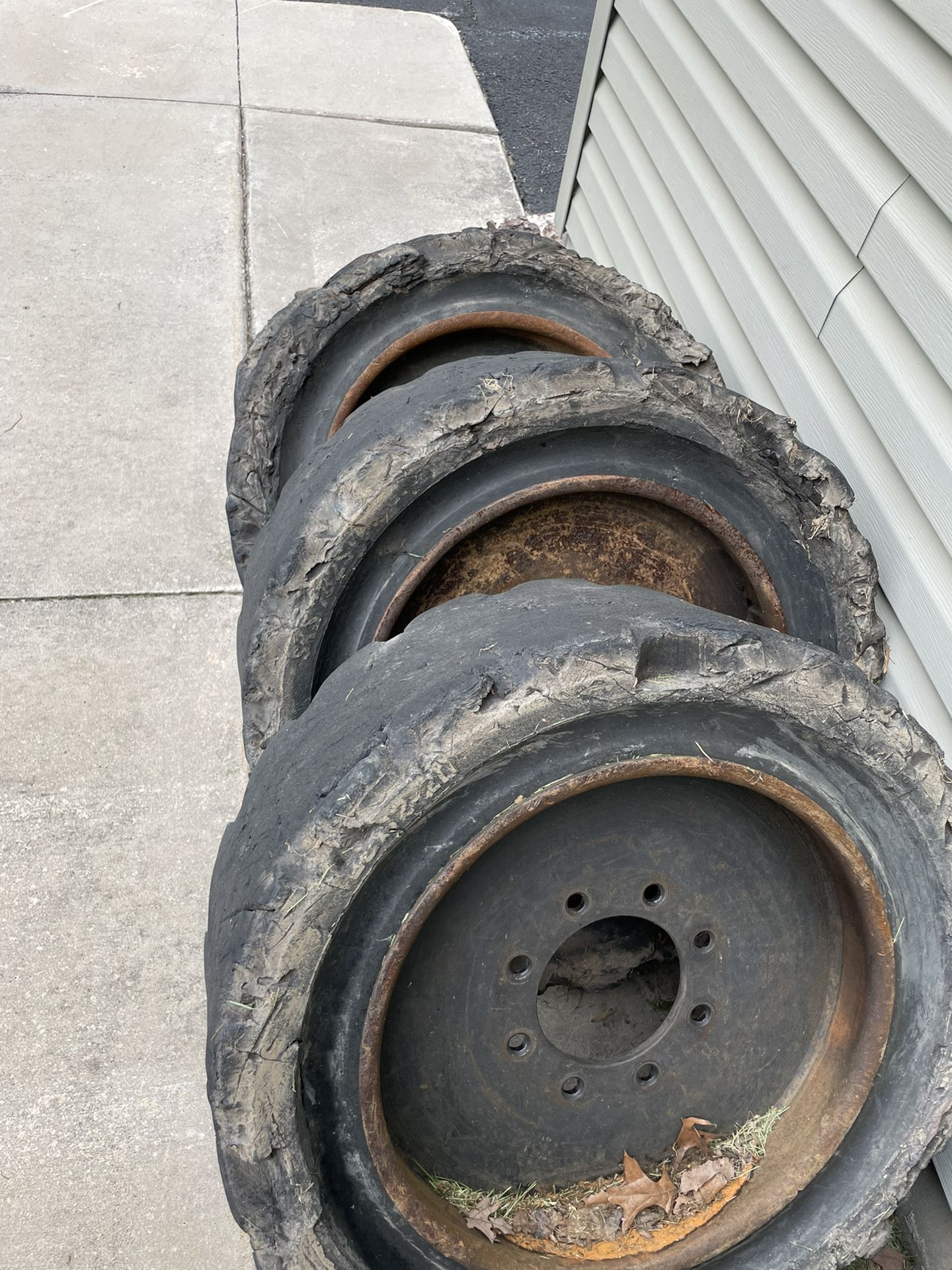 Four Bobcat Wheels And Tires 12-16.5 Solid