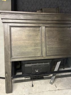 Dark Gray Wood Panel Headboard/ mattress and mini refrigerator