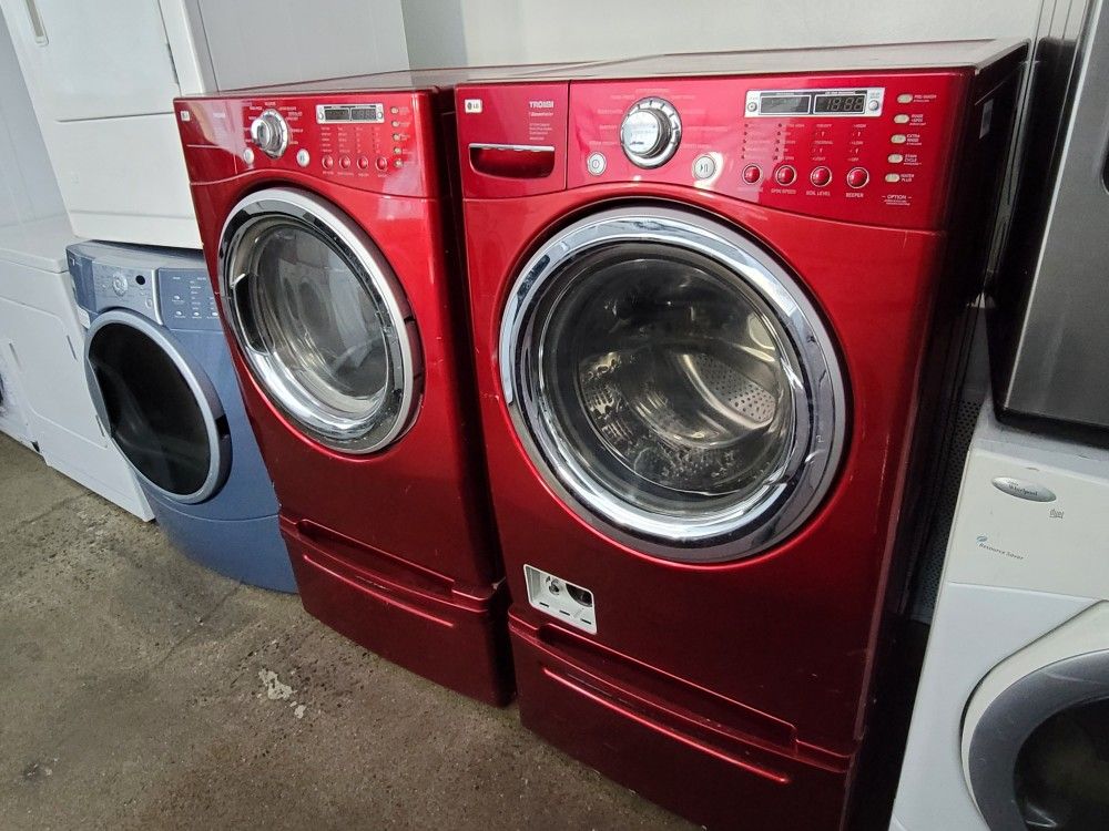 Red LG Front Load Washer And Gas Dryer Set With Pedestals