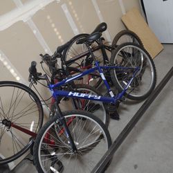Two Bikes Left Blue Huffy And Black One With Red On It 