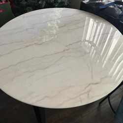 White marble dining and coffee tables