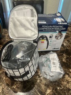 New penguin nebulizer with carrying bag never open
