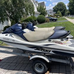 Two 2001 Kawasaki STX 3 seaters And Trailer