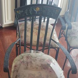 Set of four (4) wrought iron chairs.