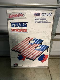 Corn hole toss game