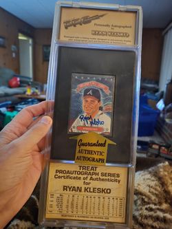 Pair of sealed autographed baseball cards of Atlanta Braves greats