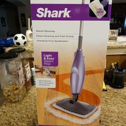 New In Box Shark Deluxe Steam Mop,

