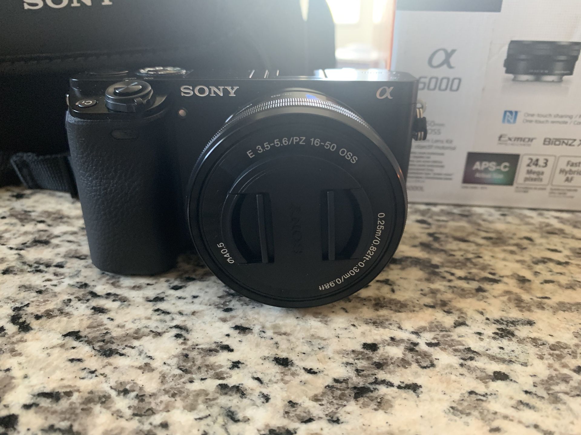 Sony A6000 w/zoom lens and memory card