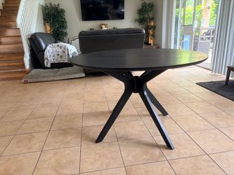 Round Black Dining Table with Starburst Base