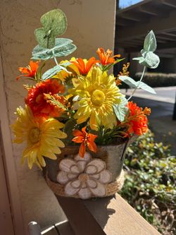 Floral arrangement in a vintage style bucket