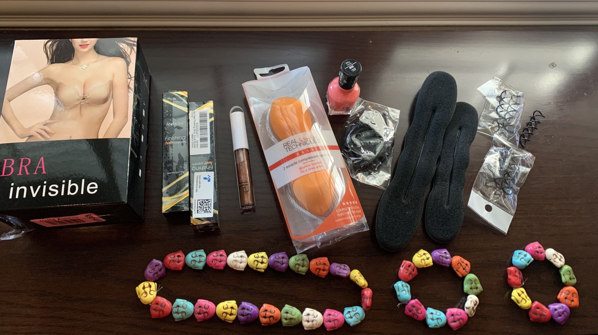 Beauty items, 2 hair finishing creams, hair items, 2 sandals 6.5, 2 invisible bras cup A (beige and black) 2 beauty blender sponges, 1 elf lip gloss,