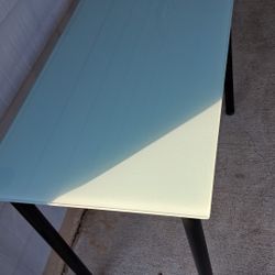 The IKEA Glasholm table is a versatile and convenient option. Its tempered glass top provides a durable and easy-to-clean surface,