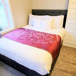 Brand-new full-size bed with four drawers underneath.