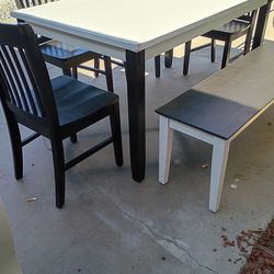 Table  with bench and 4 chairs
