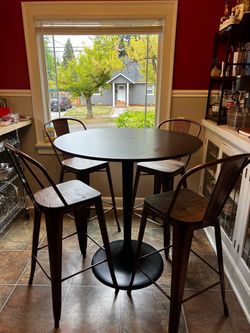tulip dining table with four chairs