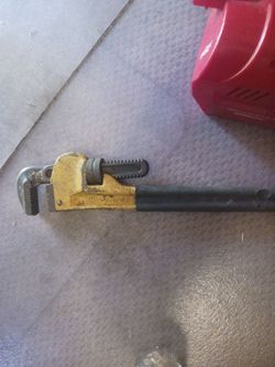 yellow Workforce brand pipe wrench, likely an 18-inch model based on the marking on the hook jaw.