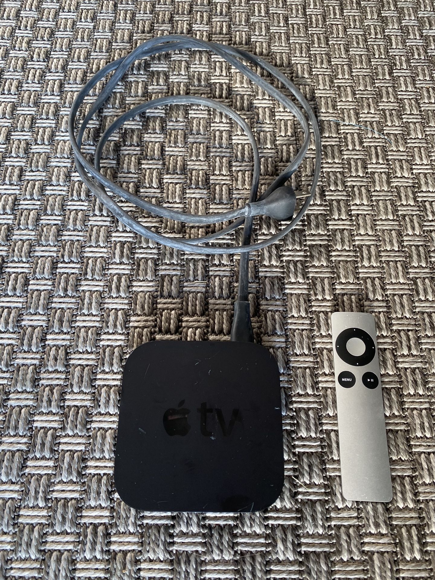 Apple TV with power cord and remote