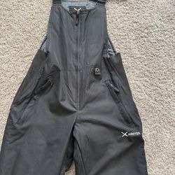 Woman’s snow boots and overalls