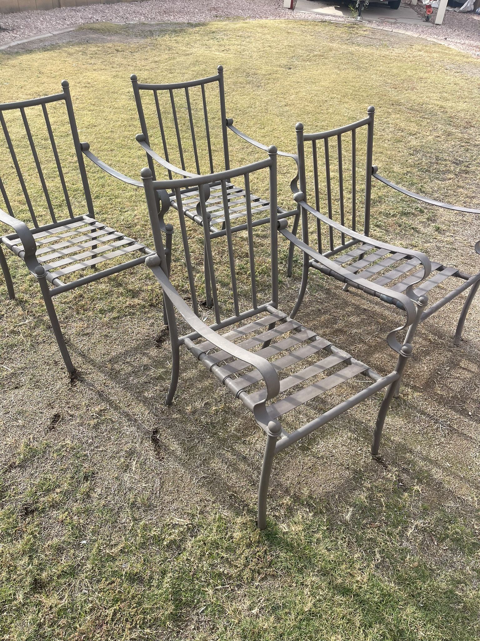Four Iron Chairs Without Cushions