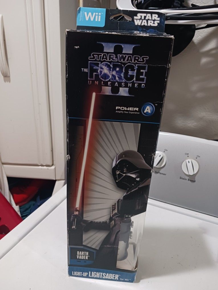 The Force unleashed ll Darth Vader Light up Light saber Nintendo Wii. new. never used.