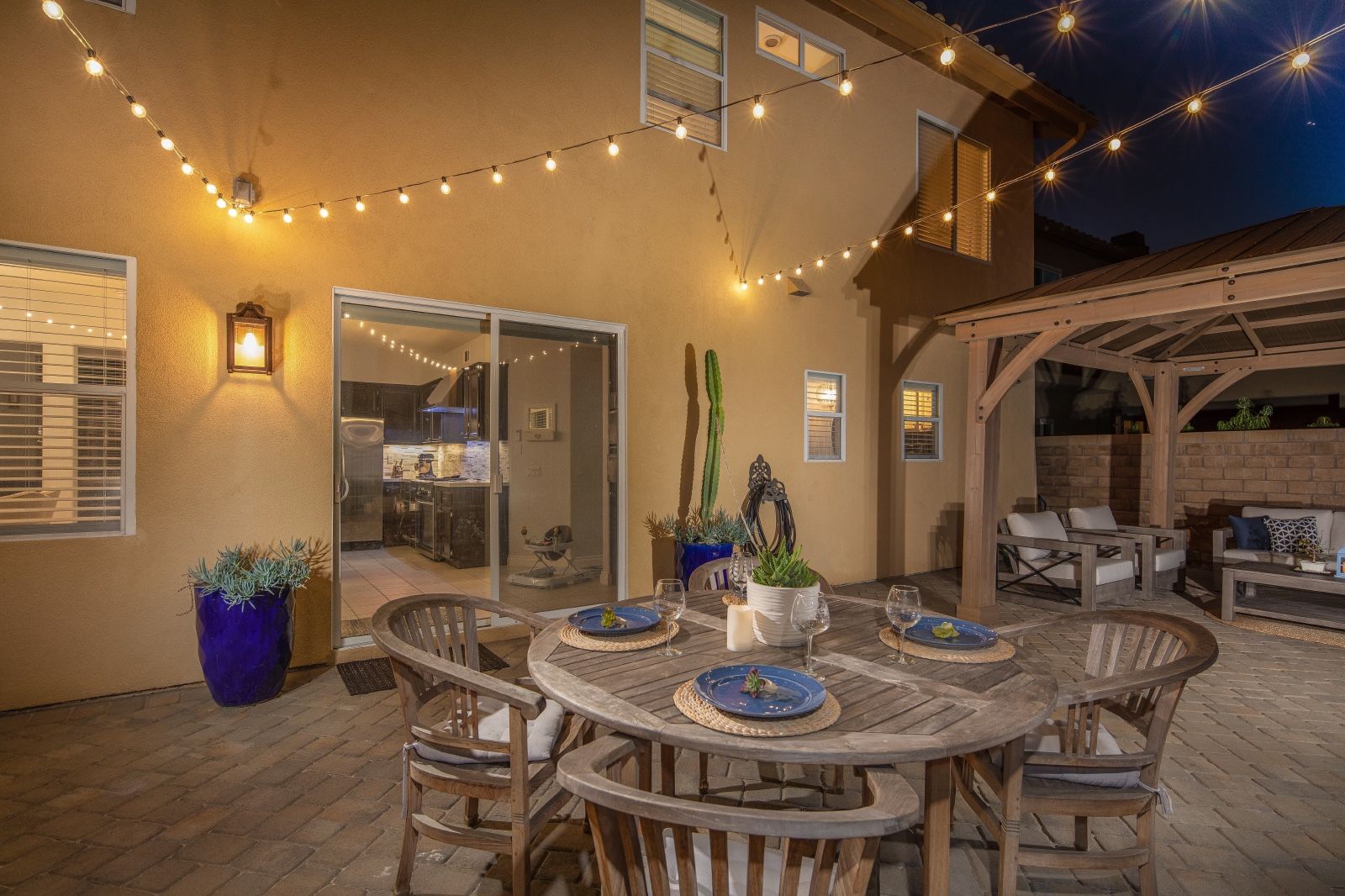 Timeless Teak table and 4 chairs with cushions. Outdoor patio furniture.