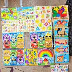 13 Wooden kids Puzzles Locks and latches $7. ea. Single Boxed puzzles both sides 10. rest are $5. Each 6 puzzle holder $5