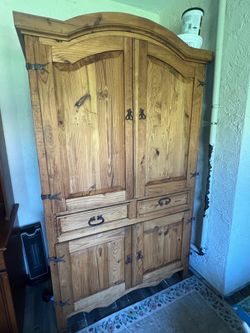 Rustic wood armoire with shelves