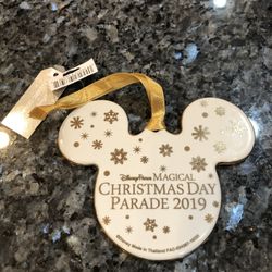 Disney Parks Exclusive 2019 Christmas ornament “Christmas Day Parade 2019.  Made of Ceramic.  Size 4 inches .  Brand New With Tags.  Purchased at Disn
