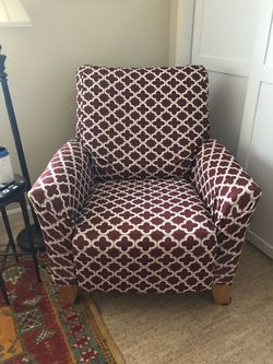 Lazy boy recliner/red leather/with slipcover does have tear on arm