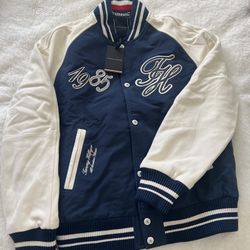 Tommy Hilfiger The Runway Collection Back Logo Varsity Jacket in a cotton blend with contrast sleeves. 