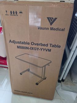 Adjustable over bed table