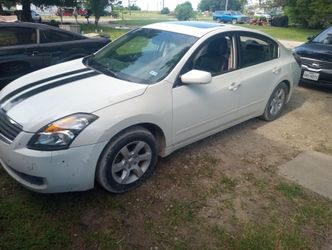A pair of Nissan Altima.