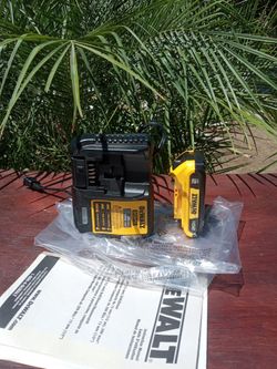 DeWalt  20 V New. Battery. 2.0 AH. W/ charger