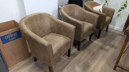 Rustic wood and iron circle table with three barrel chairs