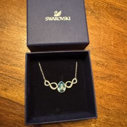 Swarovski’s Silver Blue Infinity Necklace