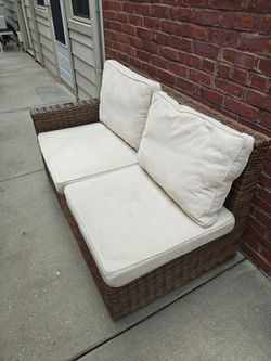 L-shaped outdoor couch with cushions