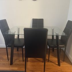 Glass Dining Table with 4 Black Chairs