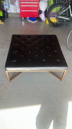 Used black leatherette ottoman