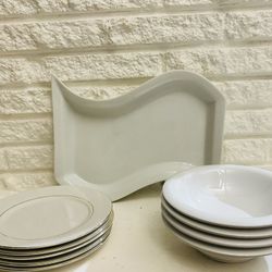 set of 4 bowls and 4 plates and one display food dish white