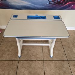 Two kids desks with two chairs.
