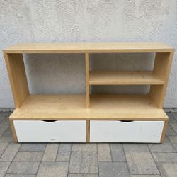 Wooden entertainment center with drawers