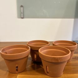 4 Small Terracotta Pots