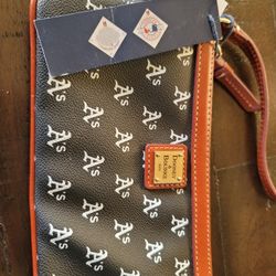 Authentic Oakland As Dooney And Bourke Clutch Leather.  $75 Pickup In Oakdale 