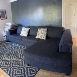 Sectional Couch, Rug And 2 TVs 
