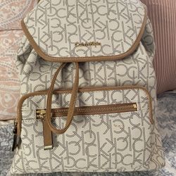 Calvin Klein Monogram Backpack Cream Tan Logo Drawstring Flap Bag