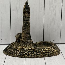 Cast iron lighthouse candle holder