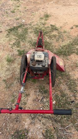 Red Gas-Powered Tow-Behind Mower