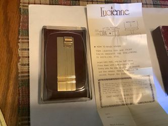 Luciennne brand new lighter gold case in original box
