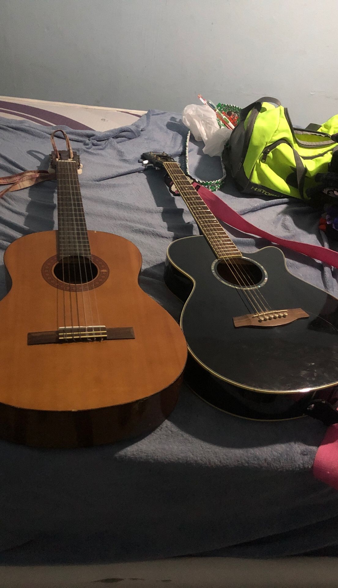 Two guitars. One is classic the other is electric